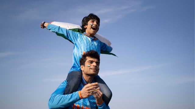 Father and son cricket fans